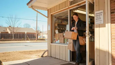 A person walking out of a store with packages handled, looking relaxed, bright daylight, open sky