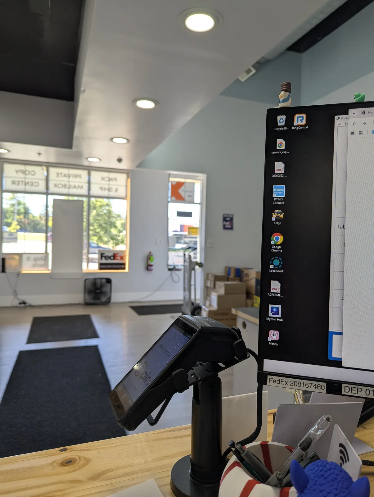 The Mailbox Plus counter in Concord Township, with PRIVATE MAILBOX on the storefront glass behind it